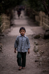 Portrait of boy standing outdoors