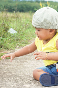 Cute baby boy on land