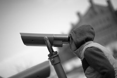 Boy looking through binoculars