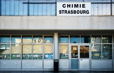 Text on glass window of building