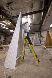 Man working on ceiling