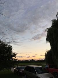 Car on road at sunset