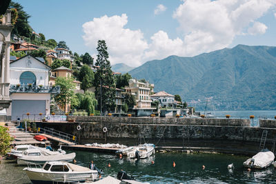 Boats moored at harbor