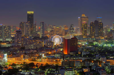 Digital composite image of illuminated buildings in city at night