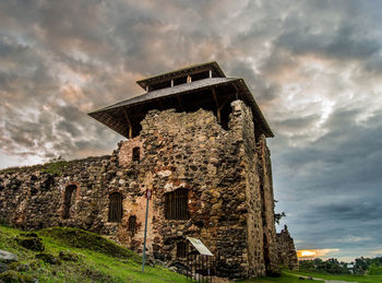 Low angle view of old ruin against sky