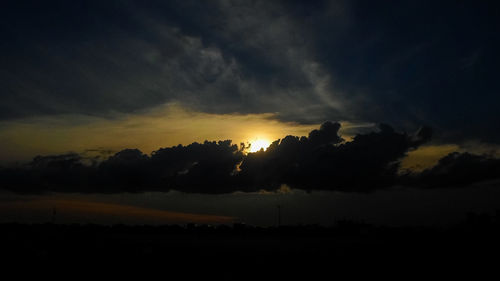 Low angle view of silhouette landscape against sky during sunset