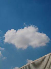 Low angle view of building against blue sky