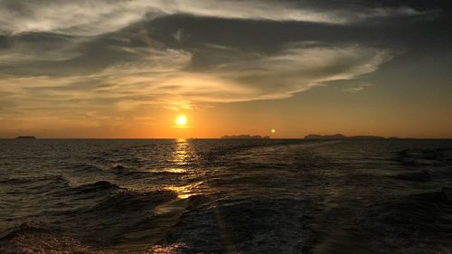 Scenic view of sea against sky during sunset