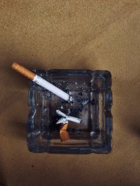 High angle view of cigarette on table