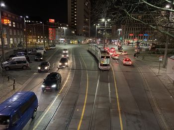 High angle view of cars on city street at night