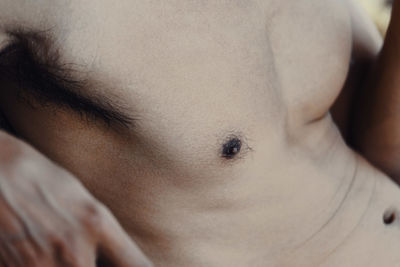 Close-up of shirtless man