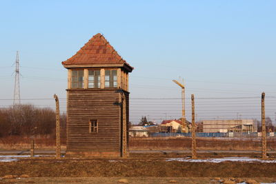 View of building on field against clear sky