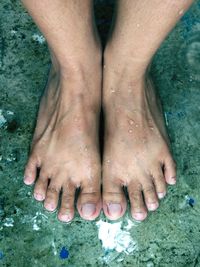 Low section of woman legs in water