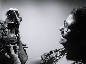 Close-up portrait of a man drinking woman