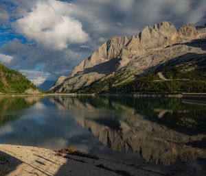 Scenic view of lake and mountains against sky