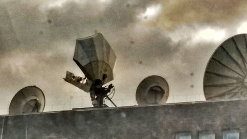 Low angle view of built structure against cloudy sky