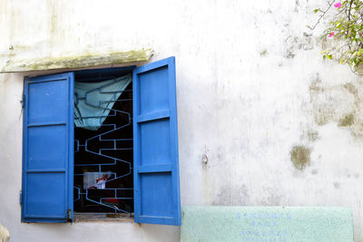 Blue window of old building