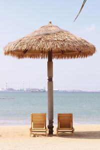 Lifeguard hut on beach against clear sky