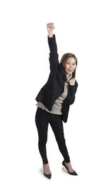 Portrait of smiling young woman against white background