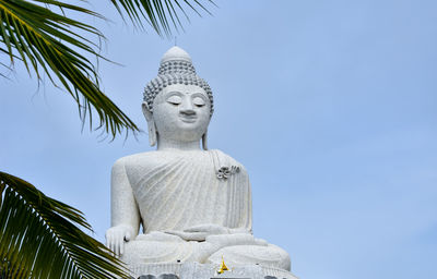 Low angle view of statue against sky