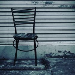 Close-up of lizard on chair