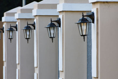 Row of street light against building