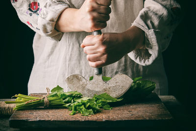 Midsection of man preparing food