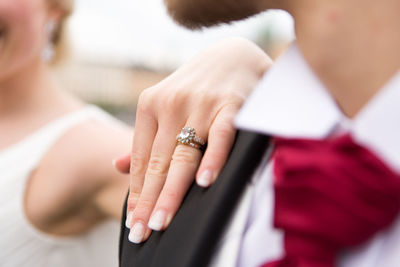 Midsection of bride and bridegroom