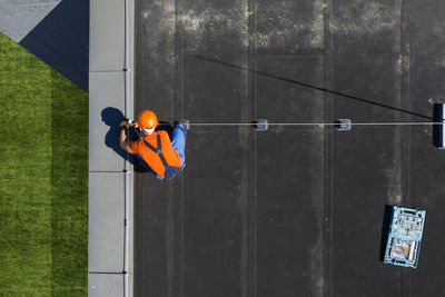 Directly above shot of man working on rooftop