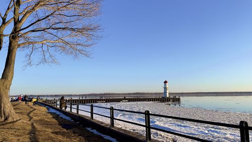 Scenic view of sea against clear blue sky