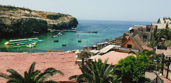 High angle view of swimming pool by sea against sky