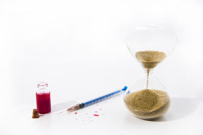 High angle view of wineglass on table against white background