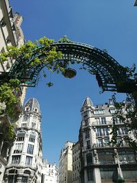 Low angle view of building against clear blue sky