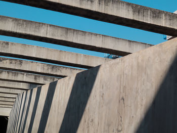 Low angle view of bridge against wall