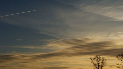 Low angle view of vapor trails in sky