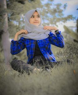 Full length portrait of girl standing on land