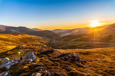 Scenic view of mountains against sky during sunset