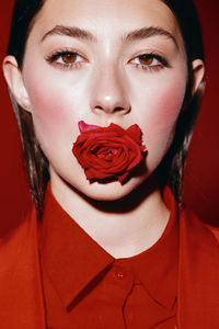 Portrait of young woman with red lipstick