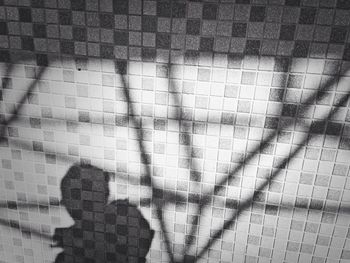 Shadow of people on footpath