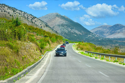 Car on road against mountain range