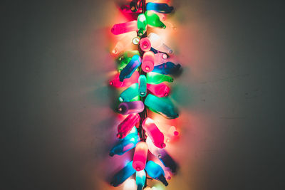 Close-up of multi colored decoration hanging against wall