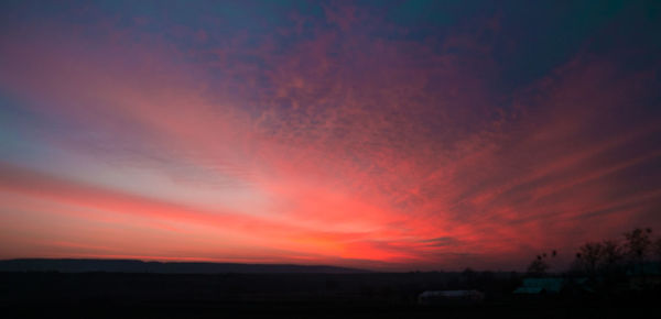 Scenic view of dramatic sky during sunset