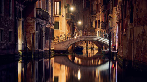 View of illuminated footbridge at night