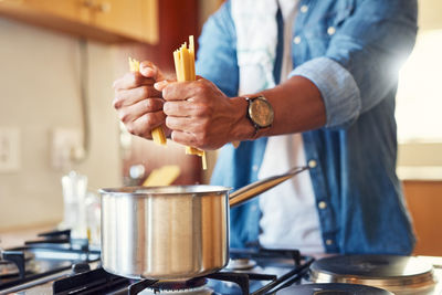 Midsection of man preparing food on table