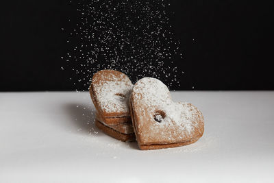 Close-up of cookies against black background