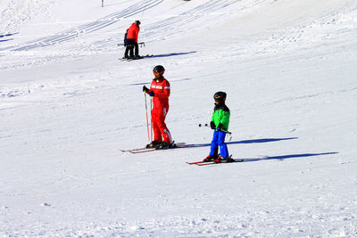 People skiing on snowcapped mountain