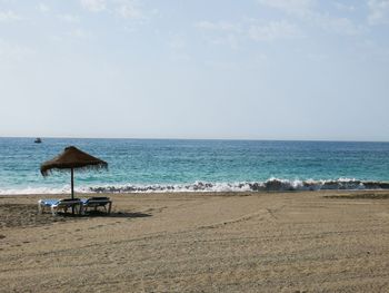 Scenic view of beach against sky