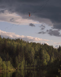 Highline over a picturesque forest lake