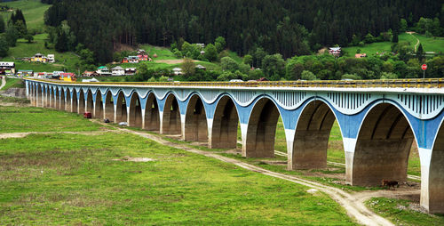 High angle view of bridge over grass fields