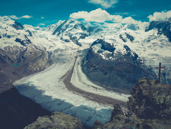 High angle view of snowcapped mountains against sky
